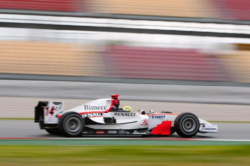 White GP2 car no. 14 with the Cyber1 logo, on a straight