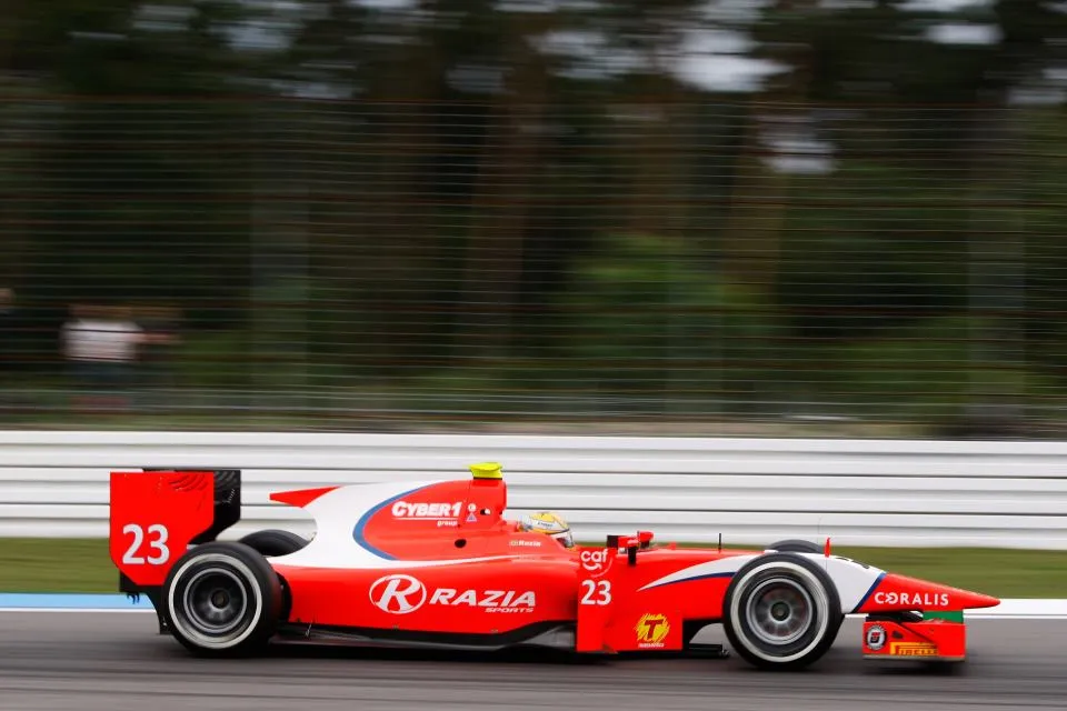 GP2 car on track with the Cyber1 group logo
