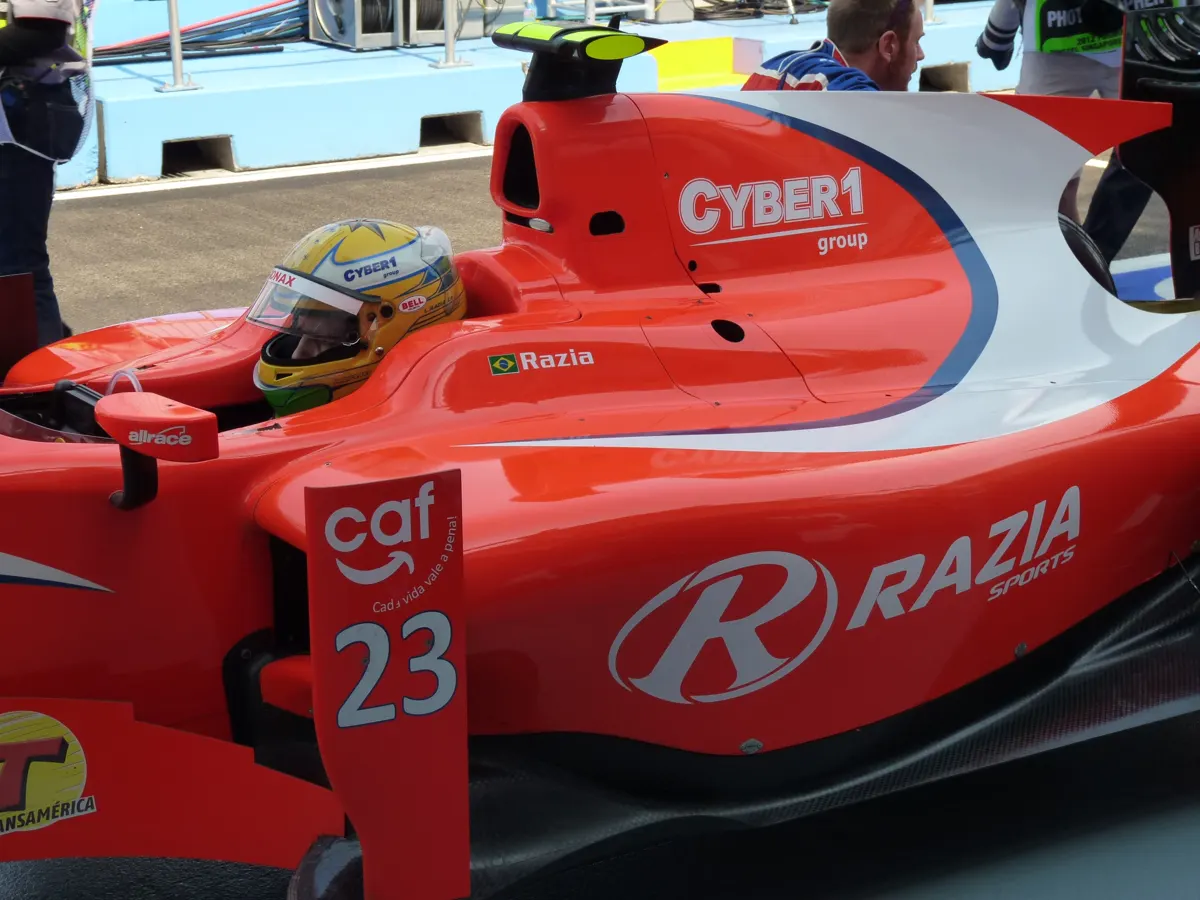 Red GP2 car with the Cyber1 group logo prominently displayed