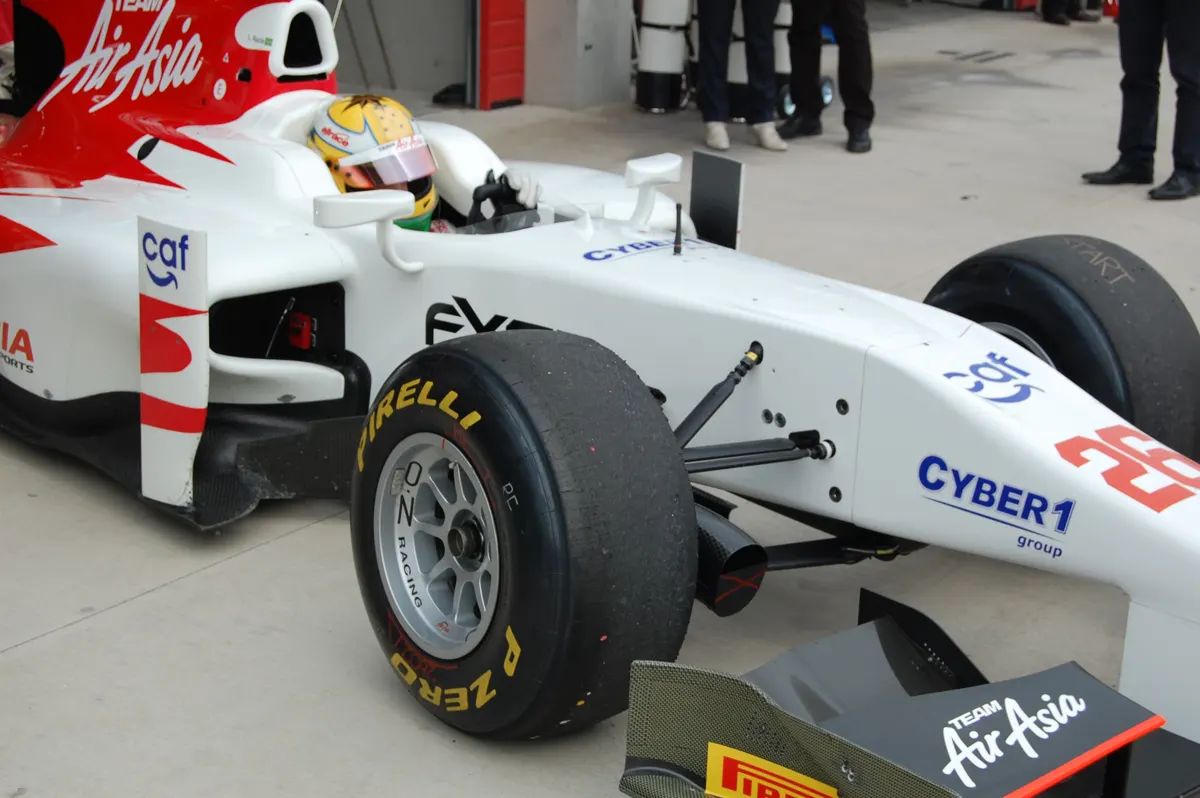 White GP2 car with the Cyber1 group logo